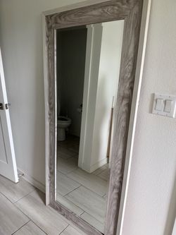 Grey “wood” frame mirror