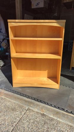 Solid wood book shelf, needs new pins for lower shelf. $75.