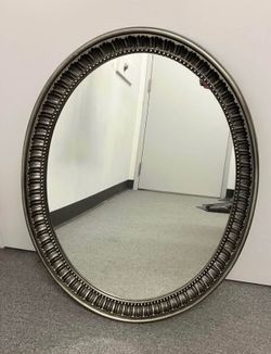 Framed oval mirror