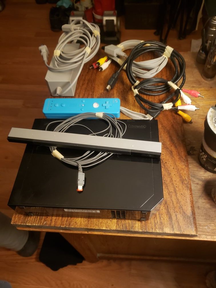 Nintendo wii , remote, and cables and hdmi