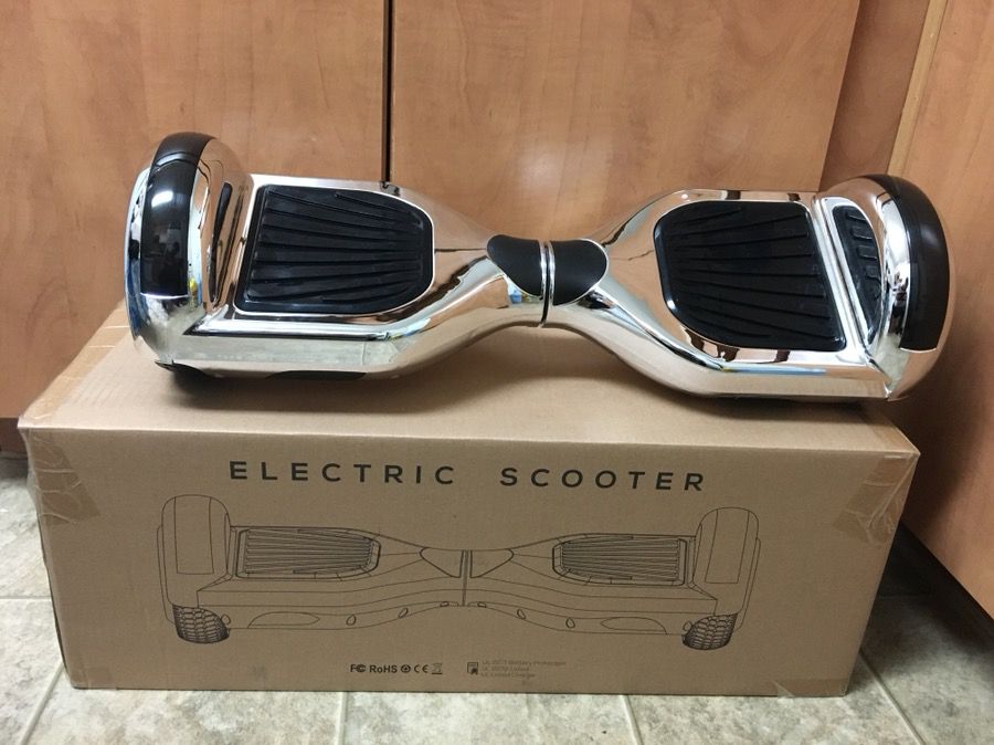 Brand new metallic silver hoverboard (has Bluetooth)