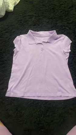 Children place school shirt