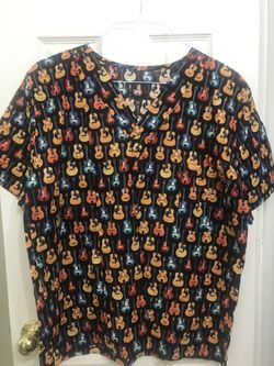 A men’s top scrub size large new guitars