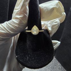This 10kt gold over 925 silver diamond Moissanite Pear-shaped ring