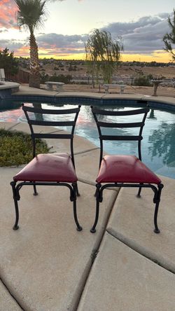 Wrought Iron Chairs with Red Cushions