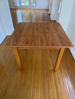 4-person wooden dining table- great condition