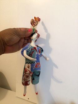 This item is a vintage, handcrafted Poupée Millet doll made in France. These unique art dolls typically feature handcrafted porcelain heads, hands, a