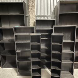 Eight Black Shelf Units. There Are Four Identical Sets Of Two.