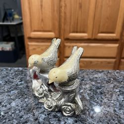 Plastic Vintage Birds Sitting On A Pedestal Silver Tone With Rise Design.  Preowned Some Of The Silver Color Has Worn Off Due To Age 