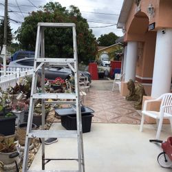 Used aluminum ladder—acceptable condition, works well. It measures 6 feet