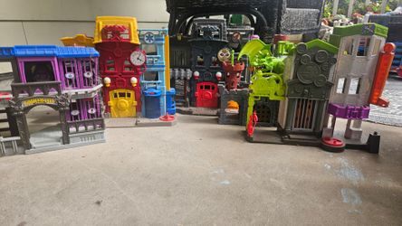 Fisher-Price Imaginext DC Super Friends playsets, including the Crime Alley set.