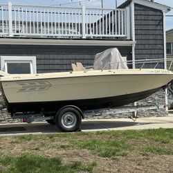 18 foot center console arrow center console fishing boat with Johnson 120 outboard. trailer included 