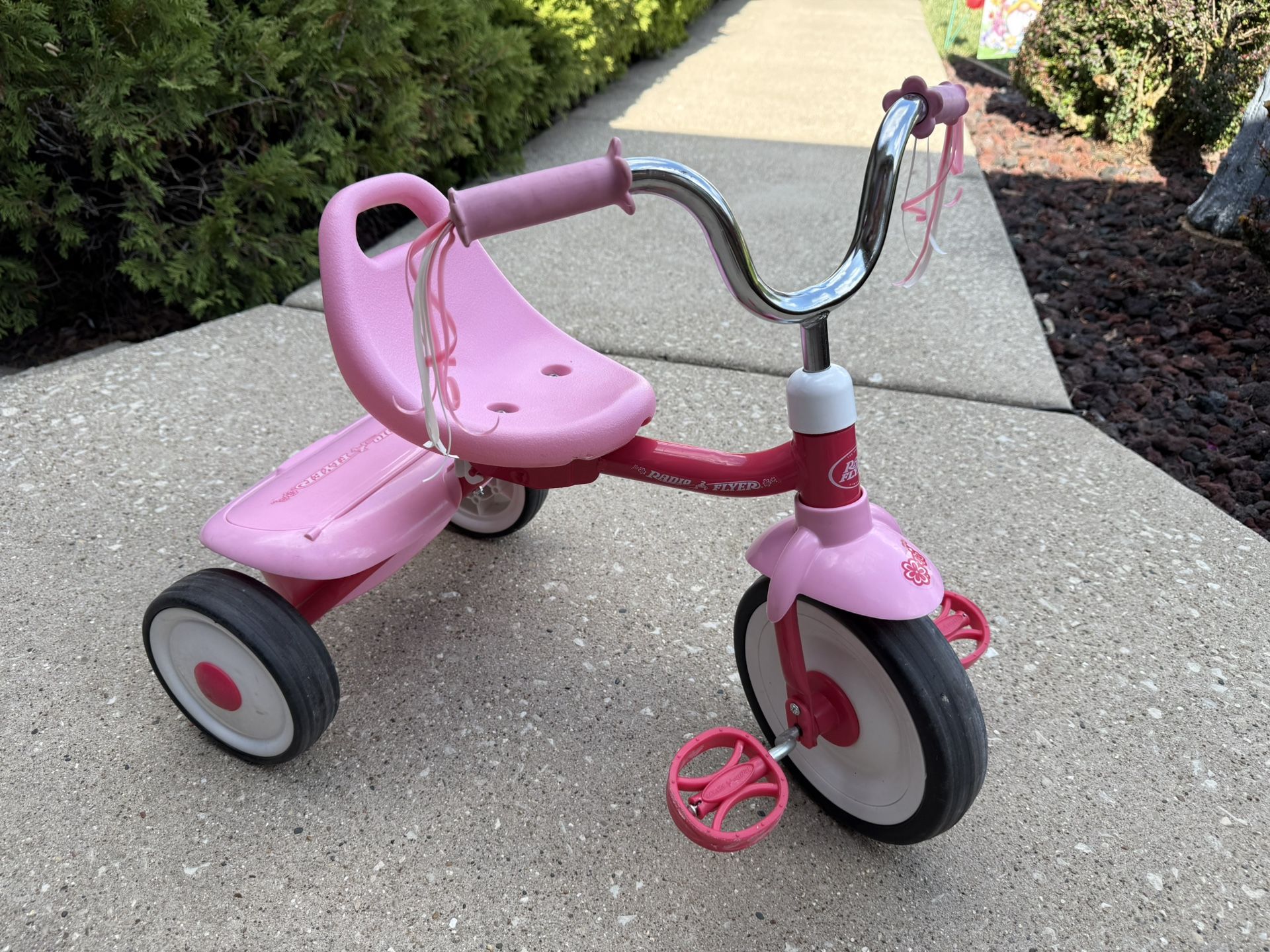 Pink Radio Flyer tricycle