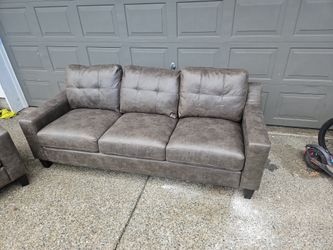 Dark Gray Leather Couch and a chair