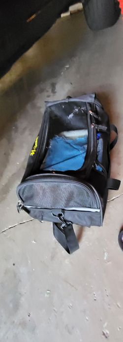 Pets carrying on luggage with handle