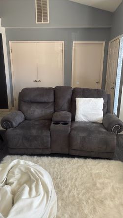 Grey sofa recliner with silver studs (Ashely Furniture )