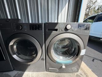 Set LG smart front-loading stackable washer and dryer.