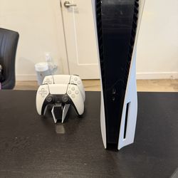 PS5 console with controllers and charger