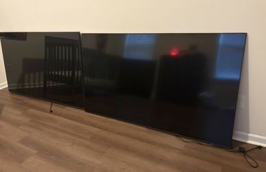 Two 75 inch TVs