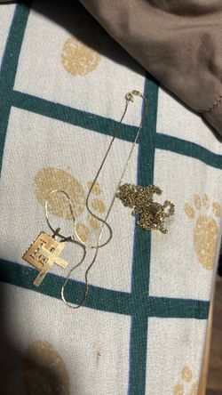 2 14k chains and 14k cross pendant and one of the chains has a 10k clip