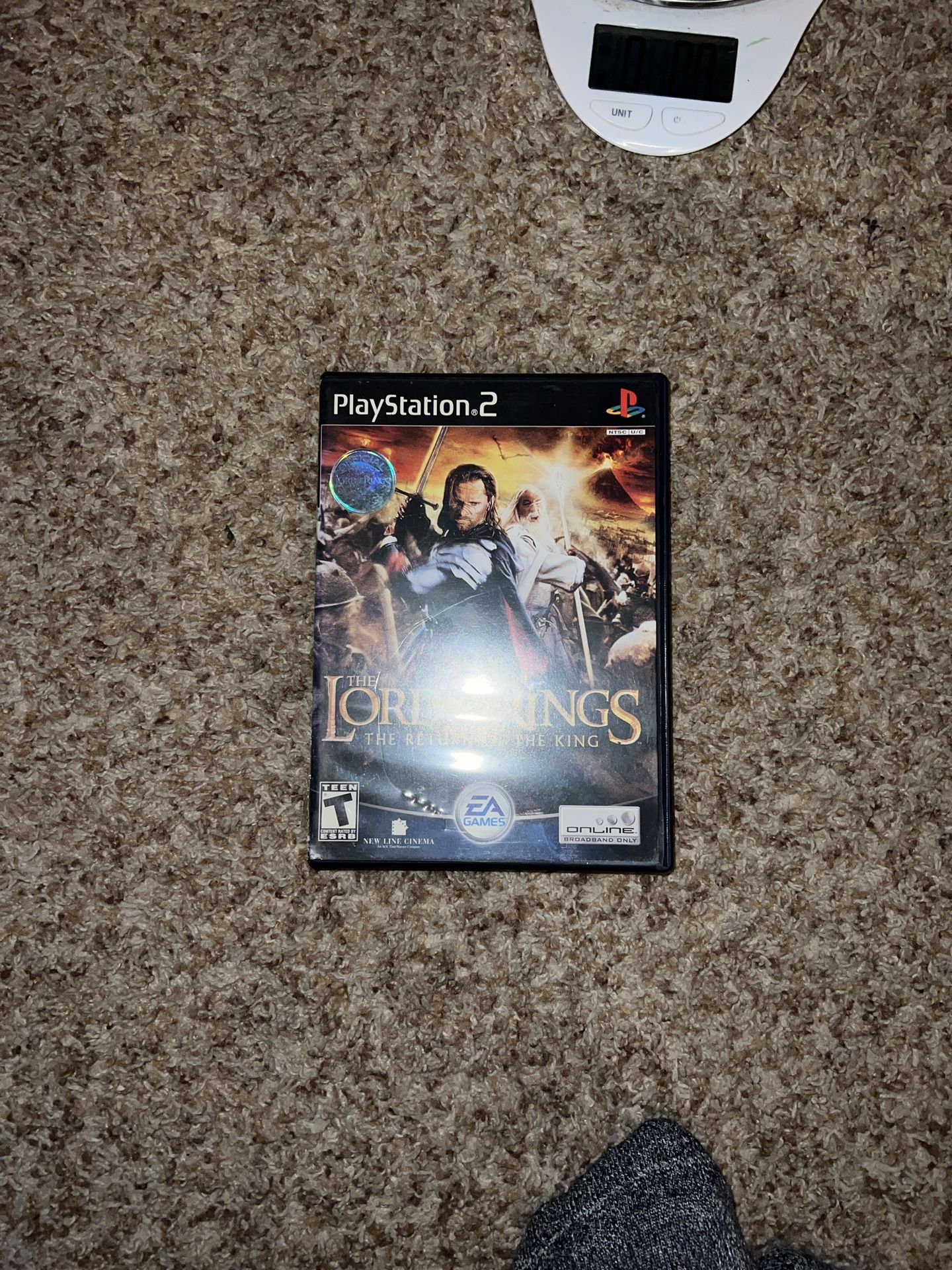 The Lord of the Rings: The Return of the King Sony PlayStation 2. Cover is ripped see pics. Does not include memory card