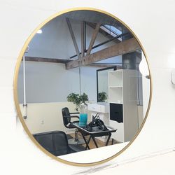 Round gold mirror