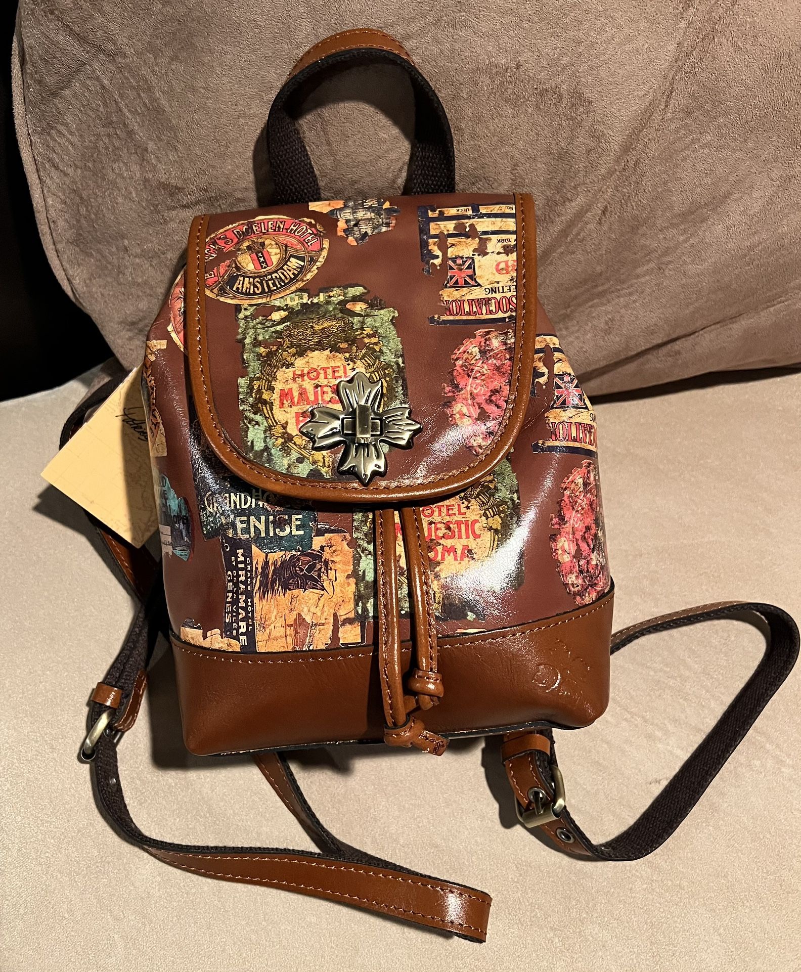 NWT Patricia Nash Saracena Vintage Travel Sticker Brown Tan Leather Backpack Handbag