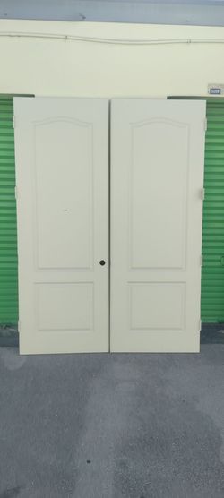 Interior two panel double doors hollow core approximately 69x95