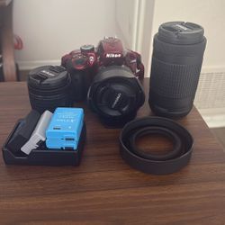 Red Nikon D3400 digital camera