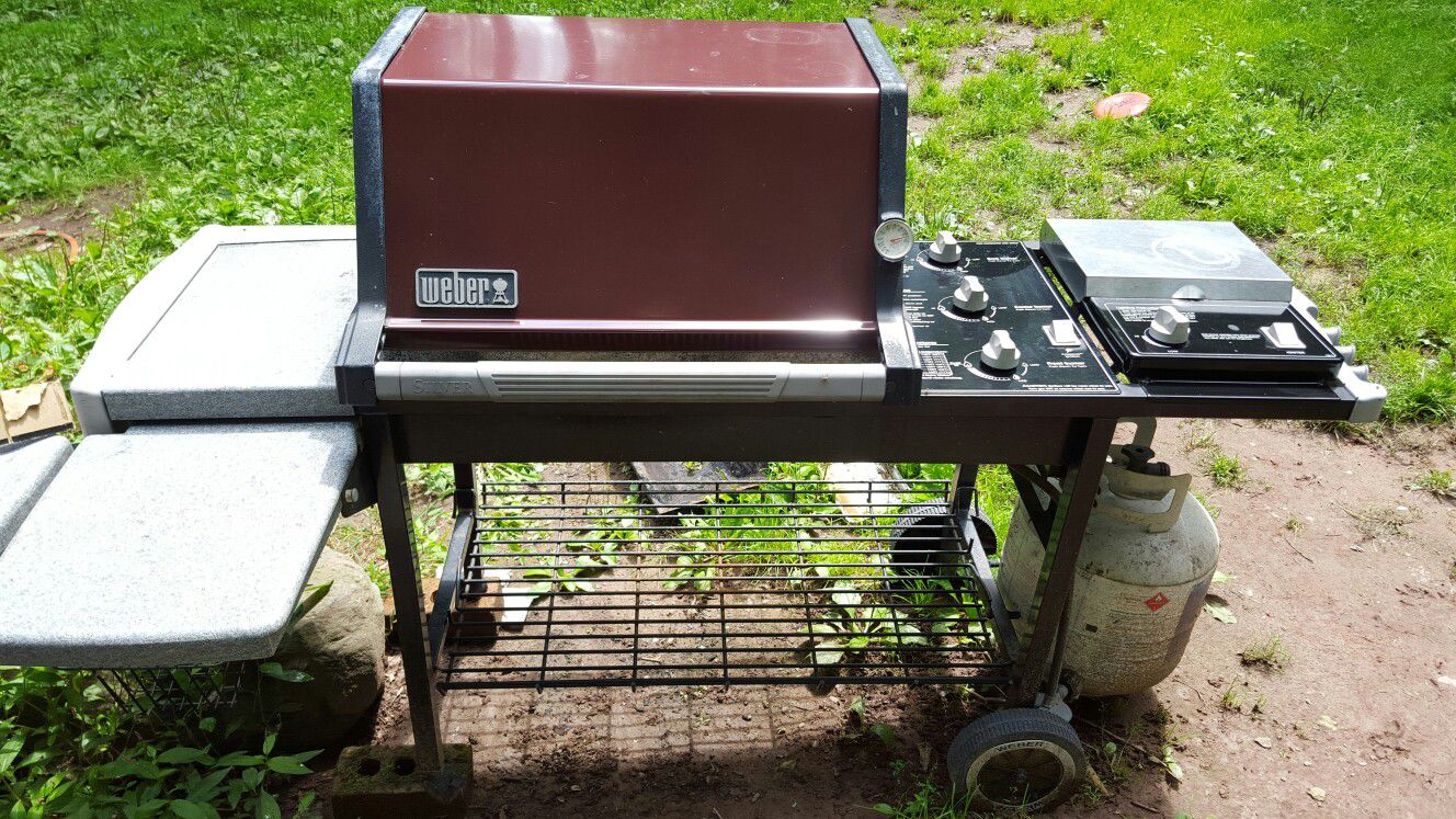 Weber Silver C Series Grill with side burner.