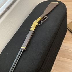 “Nerf”.   Gold Bb Gun