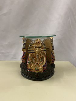 Egyptian statue with candle holder