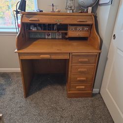 A great vintage desk, hunting lodge style. It has its flaws, but that only enhances the style.