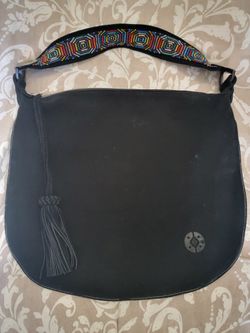 black suede bag with beaded shoulder strap