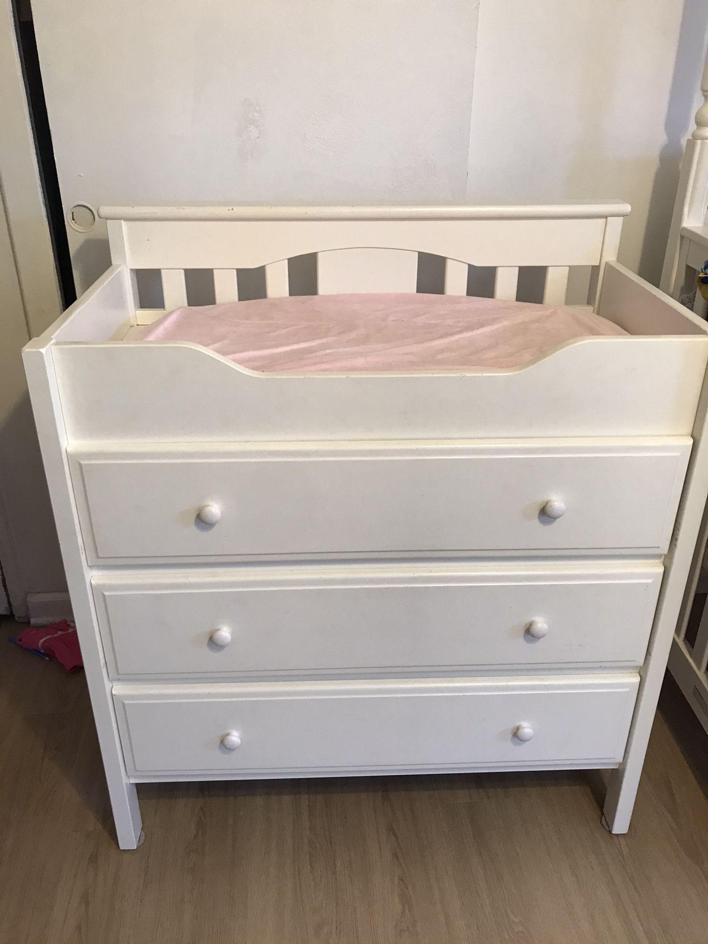 Baby changing table three drawer dresser all white with changing pad and two covers green and pink