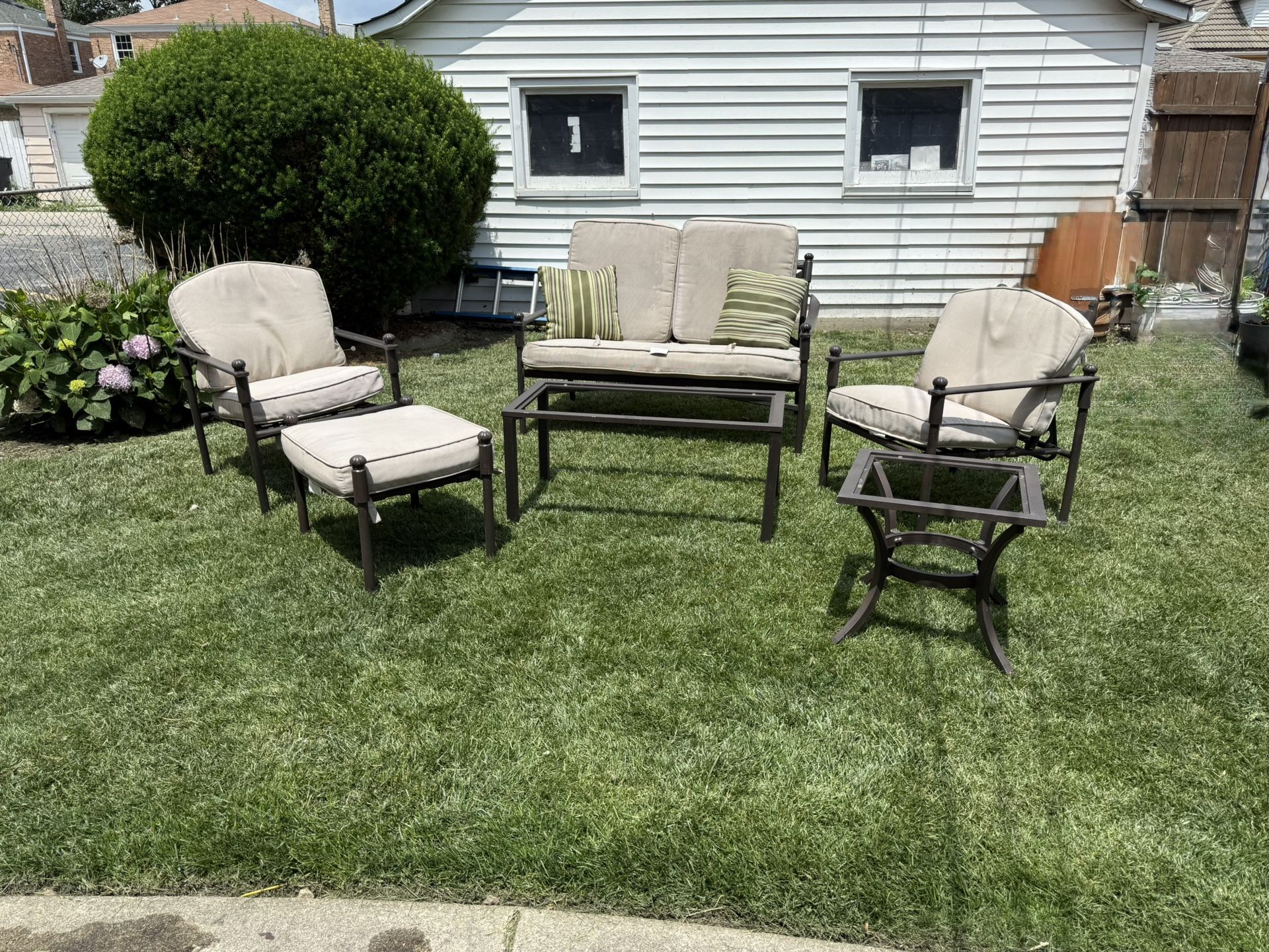 COMFORTABLE PATIO SET IN VERY GOOD CONDITION. IT INCLUDES ONE BENCH, TWO RECLINING CHAIRS, ONE OTTOMAN,TWO GLASS TOP TABLE. $200.00 OR BEST OFFER