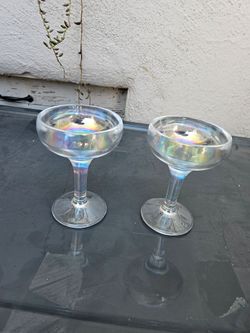 Champagne glasses. One pair us hearts and the other pair is round.