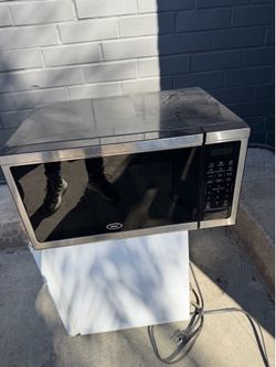 Oster microwave and room sized fridge