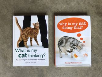 Two NEW cat hardback books