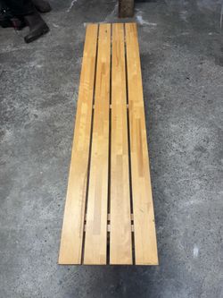 Light colored wood bench