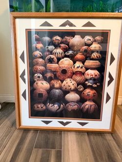 framed fine art print features a collection of Southwestern painted and etched gourd vessels by renowned New Mexico artist Robert Rivera.