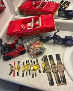 WWE Toy Lot with Belts, Vehicles, and Accessories