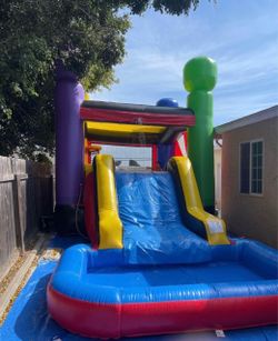 Bouncy house with slide and pool