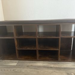 A brown cushioned cubby shelf