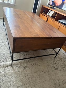 Coffee table heavy with storage