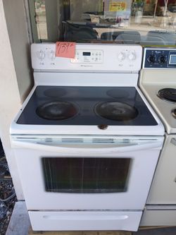 Glass top stove range oven white dent in the top works great . Warranty . Delivery available . 2203 Fowler st. Ft. Myers 33901