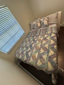 Full sized bed with mattress and frame