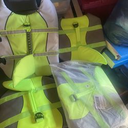 Assorted dog lifejackets from extra small to large