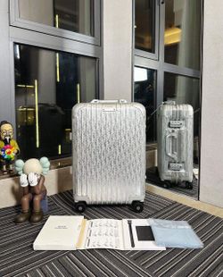 Dior Rimowa luggage