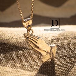 Gold praying hands 
